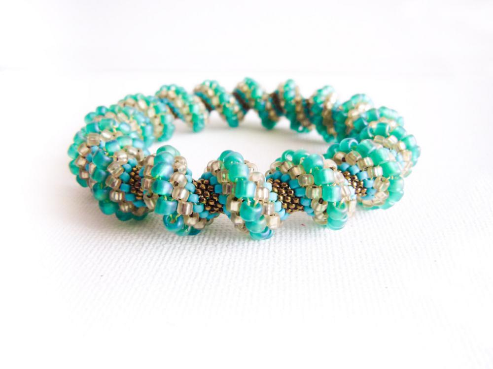 Spring Teal Green Peach Turquoise Bronze Beaded Cellini Spiral Bracelet. Fashion Jewelry